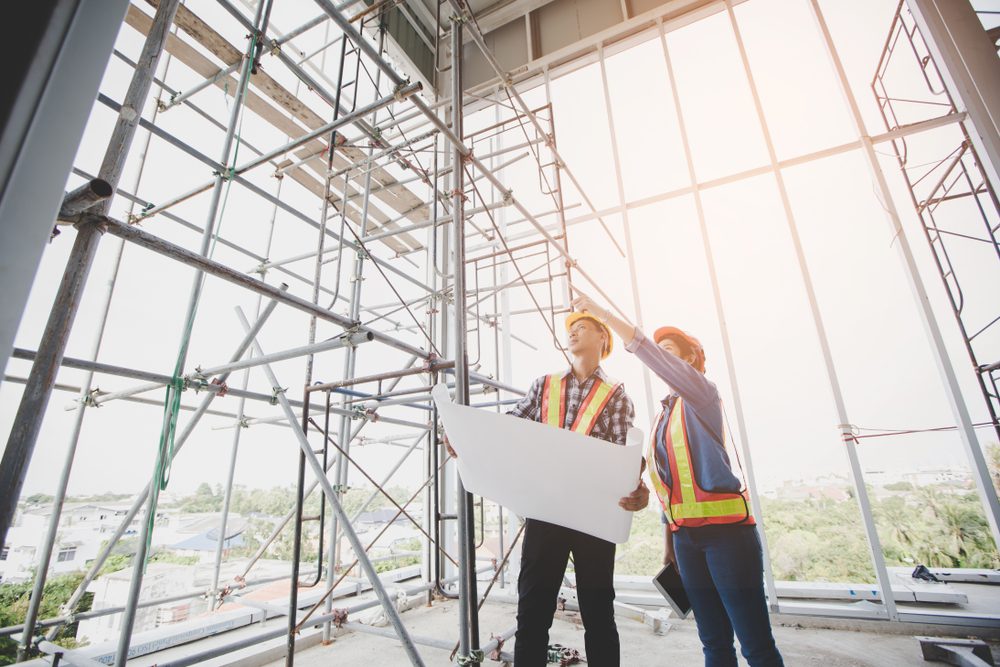 Engineers,Are,Meeting,And,Pointing,To,New,Construction,Sites,,Engineering